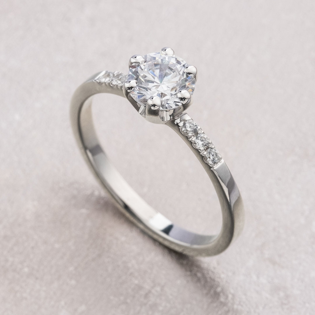 Classic diamond engagement ring with side stones