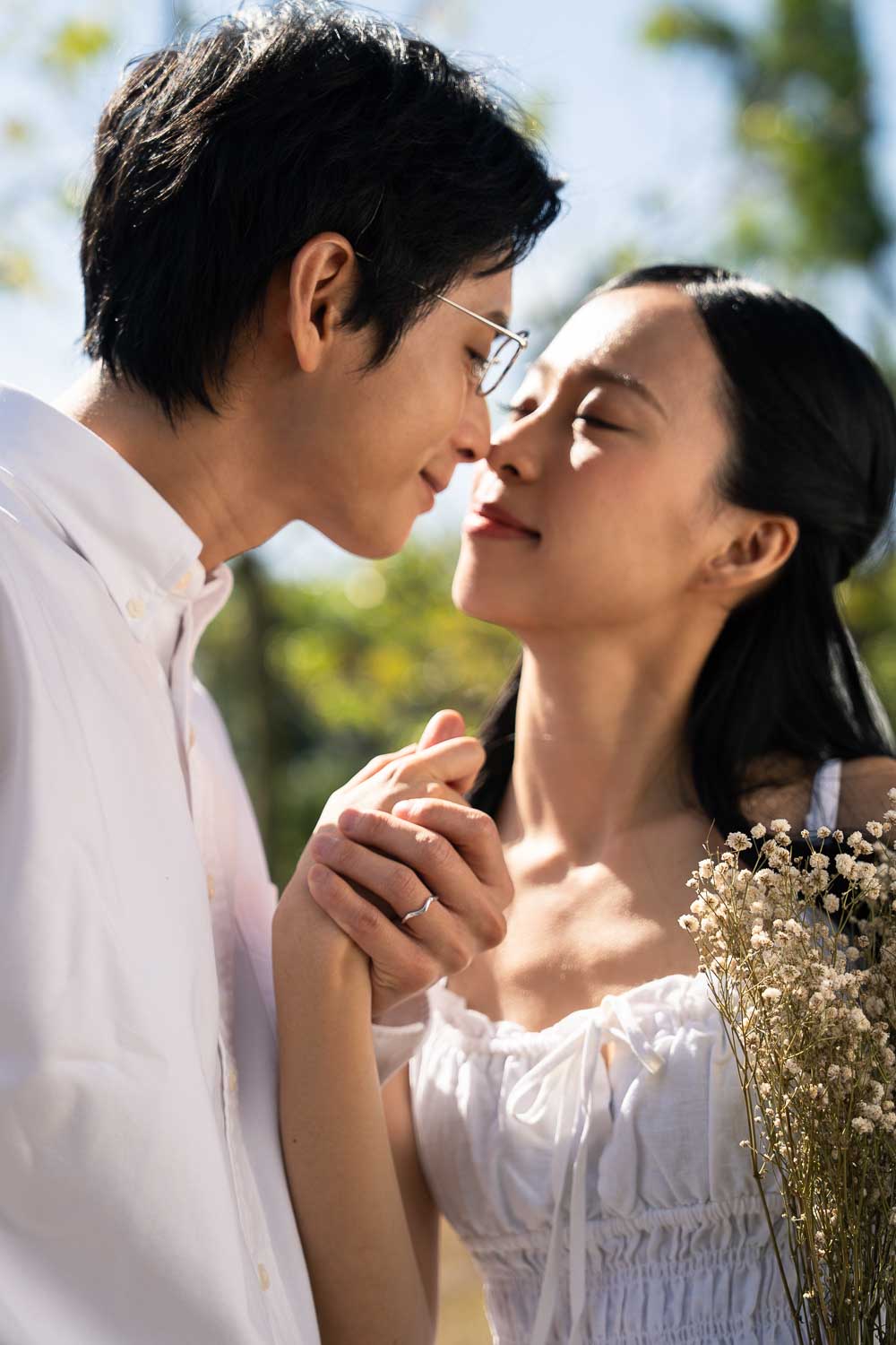 A couple holding hands after the proposal