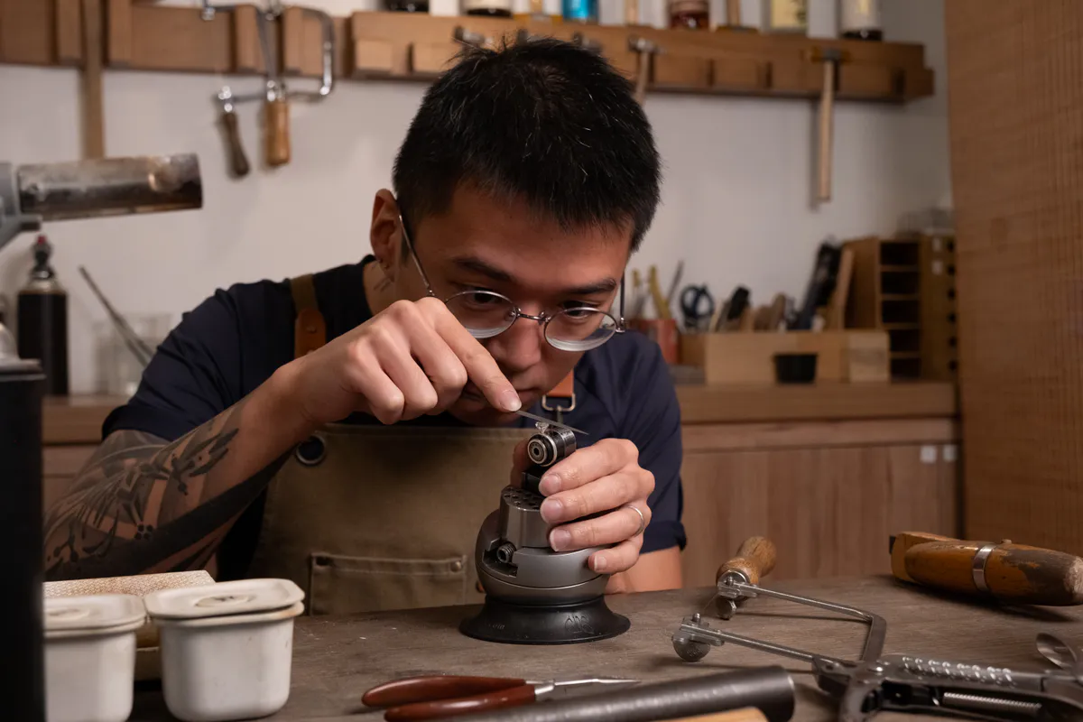 Participant independently crafting an engagement ring at a jewellery bench